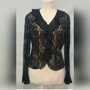 Kate Hill black lace ruffle top, characterized by its intricate floral lace